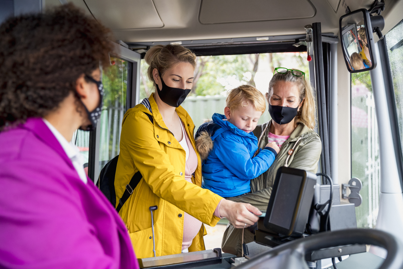 Women and child getting onto bus