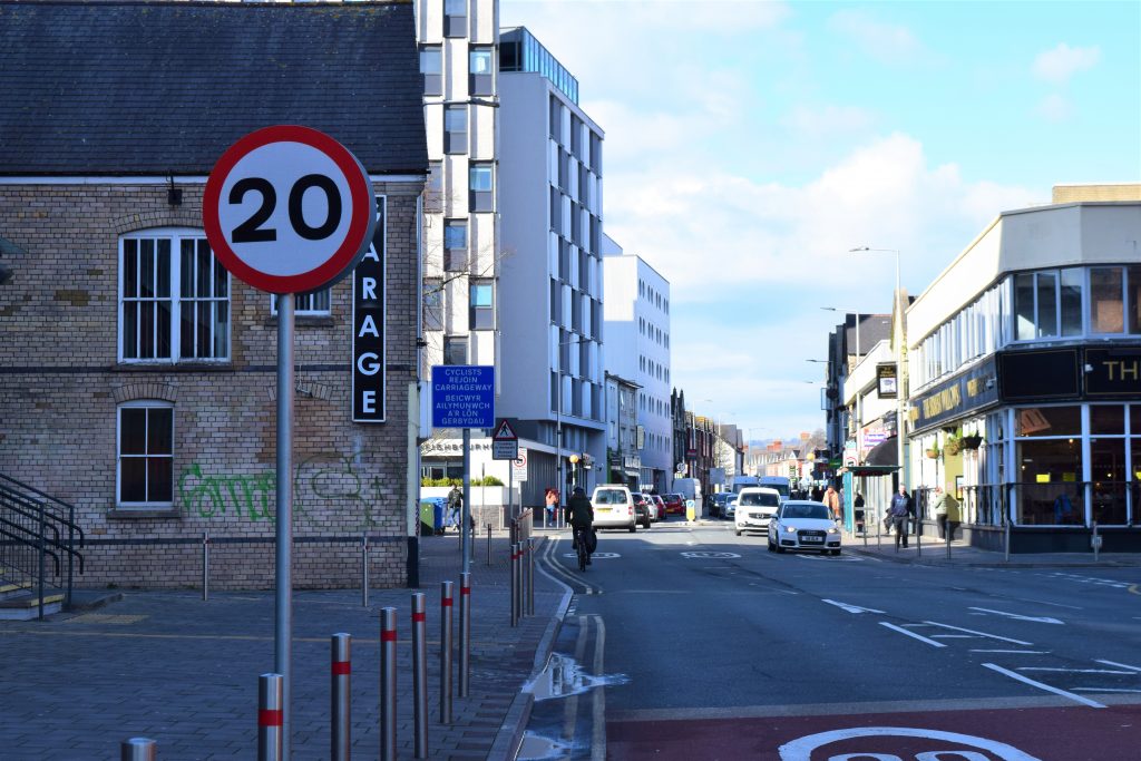 20 mph sign on town street