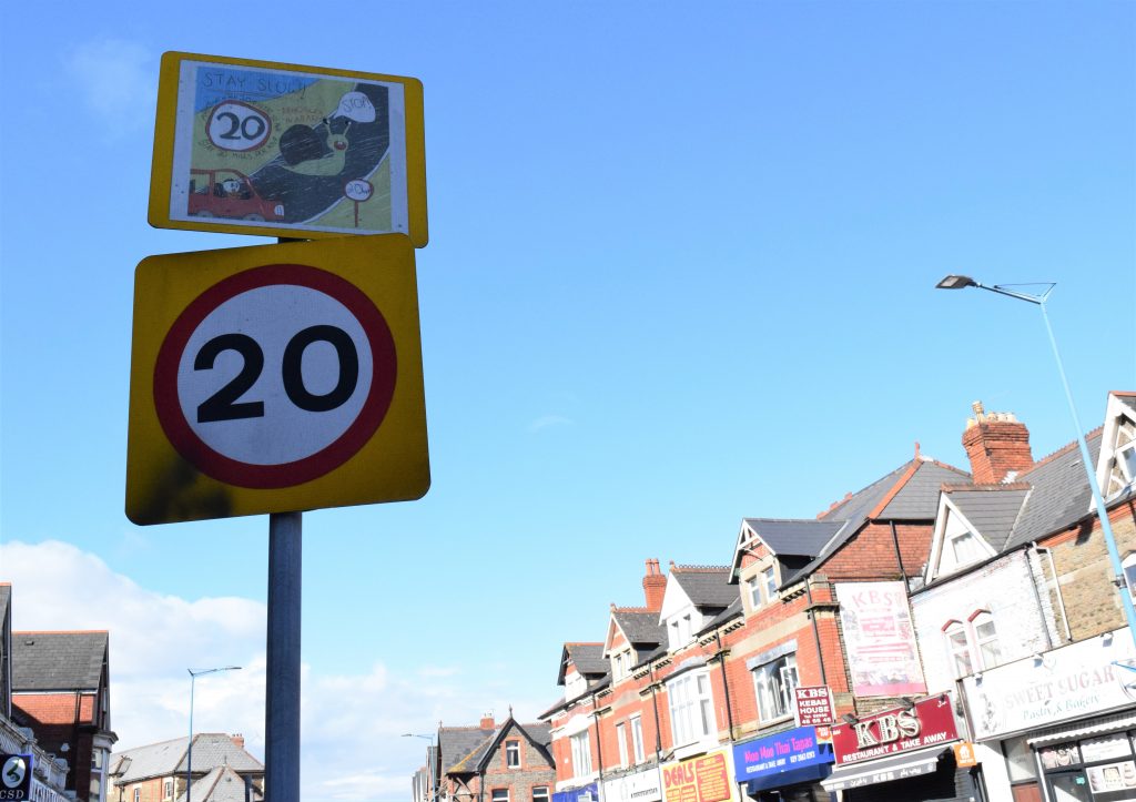 20 mph sign on town street